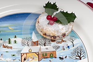 Mince pies on a Christmas plate.