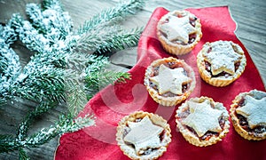 Mince pies with Christmas tree branch