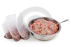 Minced barf raw food recipe for dogs consisting meat, organs, fish, eggs and vegetable are packaged for freezing