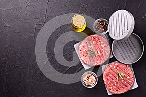 Minced beef steak burgers with spices. Raw fresh hamburger patties or cutlet ready to cook