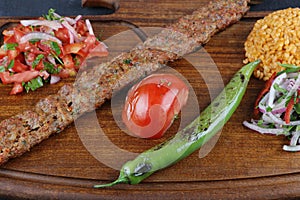 Minced lamb kebab with vegetables  Turkish Cuisine Adana Kebab .