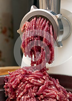 Minced meat in grinder