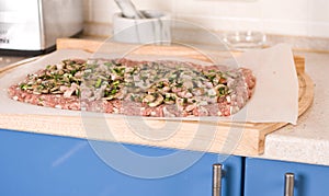 Minced meat before rolling over the kitchen