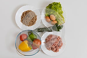 Minced meat with vegetables and buckwheat with eggs. Culinary background