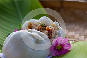 Minced Pork with Boiled Egg steamed bun hand made on banana leaf close up