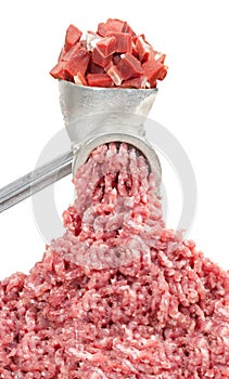 Mincer and a pile of chopped meat photo