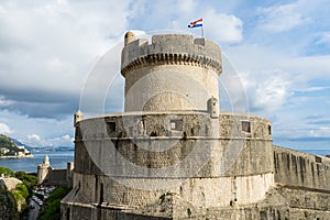 Minceta Tower at sanset lights and Dubrovnik medieval old town city walls, Croatia