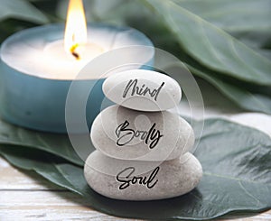 Mind, Body and Soul words engraved on zen stones. Zen concept