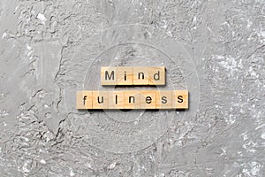 Mind fulness word written on wood block. mind fulness text on table, concept