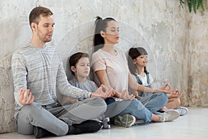 Mindful calm happy healthy family practicing breathing yoga exercises.