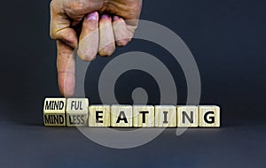 Mindful or mindless eating symbol. Doctor turns cubes and changes words mindless eating to mindful eating. Beautiful grey