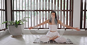 Mindful Movement, Sporty Woman in Lotus Pose Finding Inner Peace Indoors