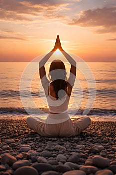 Mindful Yoga Practice At Sunrise Facing The Ocean In Tranquil Natural Setting
