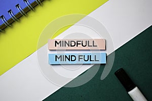Mindfull or Mind Full text on sticky notes with office desk concept