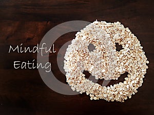 Mindfulness Eating concept using oat formed into a smiley face