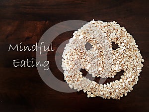 Mindfulness Eating concept using oat formed into a smiley face photo