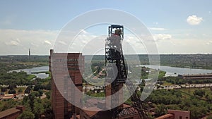 Mine in the city red iron ore aerial drone right side camera movement. Drone aerial high angle view panning