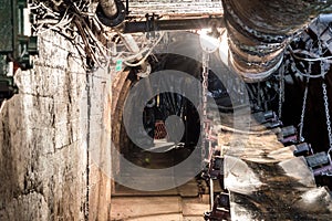 Mine equipment in illuminated tunnel