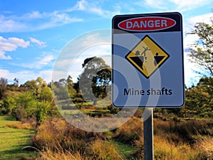 Mine shafts danger sign in Australian gold-mining countryside photo