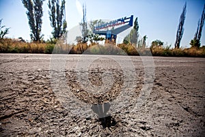 Mine shell stuck in the road, War actions aftermath, Ukraine and Donbass conflict photo