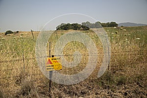 Minefield in Israel with a yellow sign Danger mines