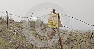 Minefield warning sign in the Golan Heights in the Syria Israel border