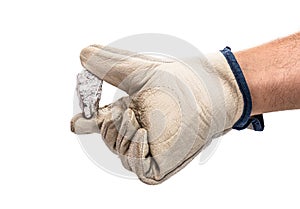 Miner hand with protective glove holding silver color ore, metallic stone, isolated white background. Steelmaking or mining