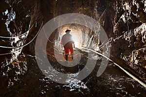 Miner inside an underground gold and copper mine