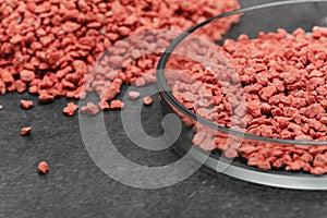 Mineral fertilizer with phosphorus in red with chemical glass