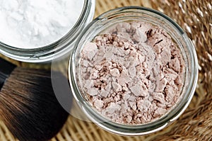 Mineral homemade powder foundation or dry shampoo in a grass jar. DIY cosmetics. Close up, copy space.