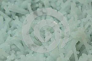 The mineral prehnite close-up. Texture, background. Selective focus. Abstract background