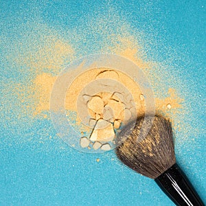 Mineral shimmer powder golden color with makeup brush