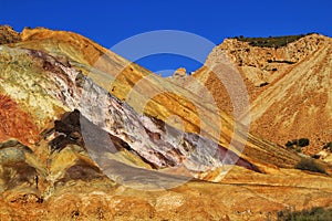 Mineral streaks and sediments in a old abandoned quarry