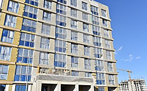 Mineral wool and plaster applied on new multi-storey building facade. Insulation for thermal protection to the shell of the house