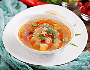 Minestrone - `big soup`, soup with many ingredients - a dish of Italian cuisine