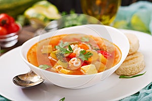 Minestrone - `big soup`, soup with many ingredients - a dish of Italian cuisine