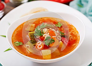 Minestrone - `big soup`, soup with many ingredients - a dish of Italian cuisine