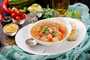 Minestrone - `big soup`, soup with many ingredients - a dish of Italian cuisine