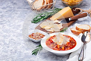 Minestrone soup with cavatappi pasta, beans and vegetables with crispy bread, horizontal, copy space