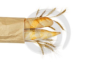 Mini baguettes in pacage with wheat on white background
