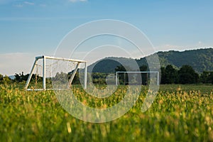 Mini and big soccer goal in the field. Selective Focus.