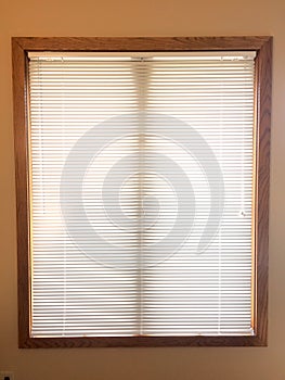 Mini blinds on wood window frame