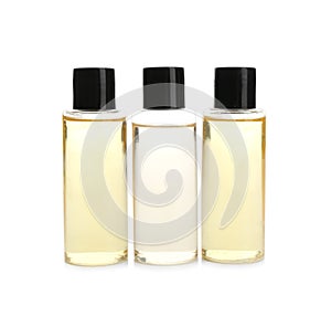 Mini bottles with cosmetic products on white. Hotel amenities