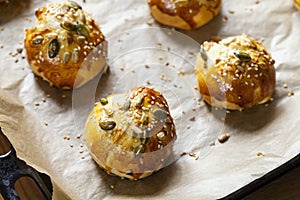 Mini brioche buns on the baking tray
