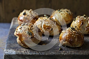 Mini brioche buns on the wooden board