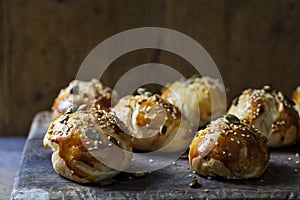 Mini brioche buns on the wooden board