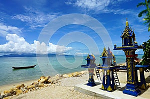 Mini Buddhist Temples along the beach photo