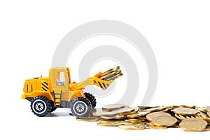 Mini bulldozer truck loading stack coin with pile of gold coin,
