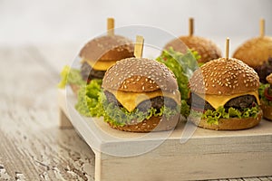 Mini burgers with cheese and lettuce