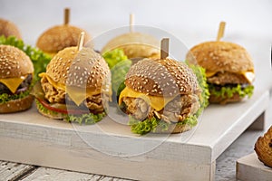 Mini burgers with cheese and lettuce